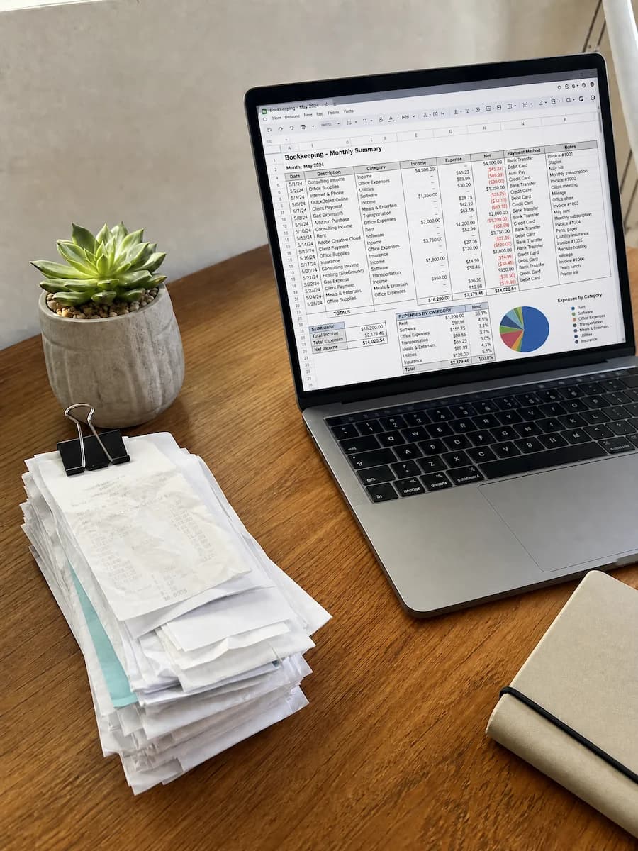 Organized financial documents and calculator on a desk